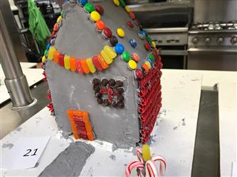 A grey gingerbread house